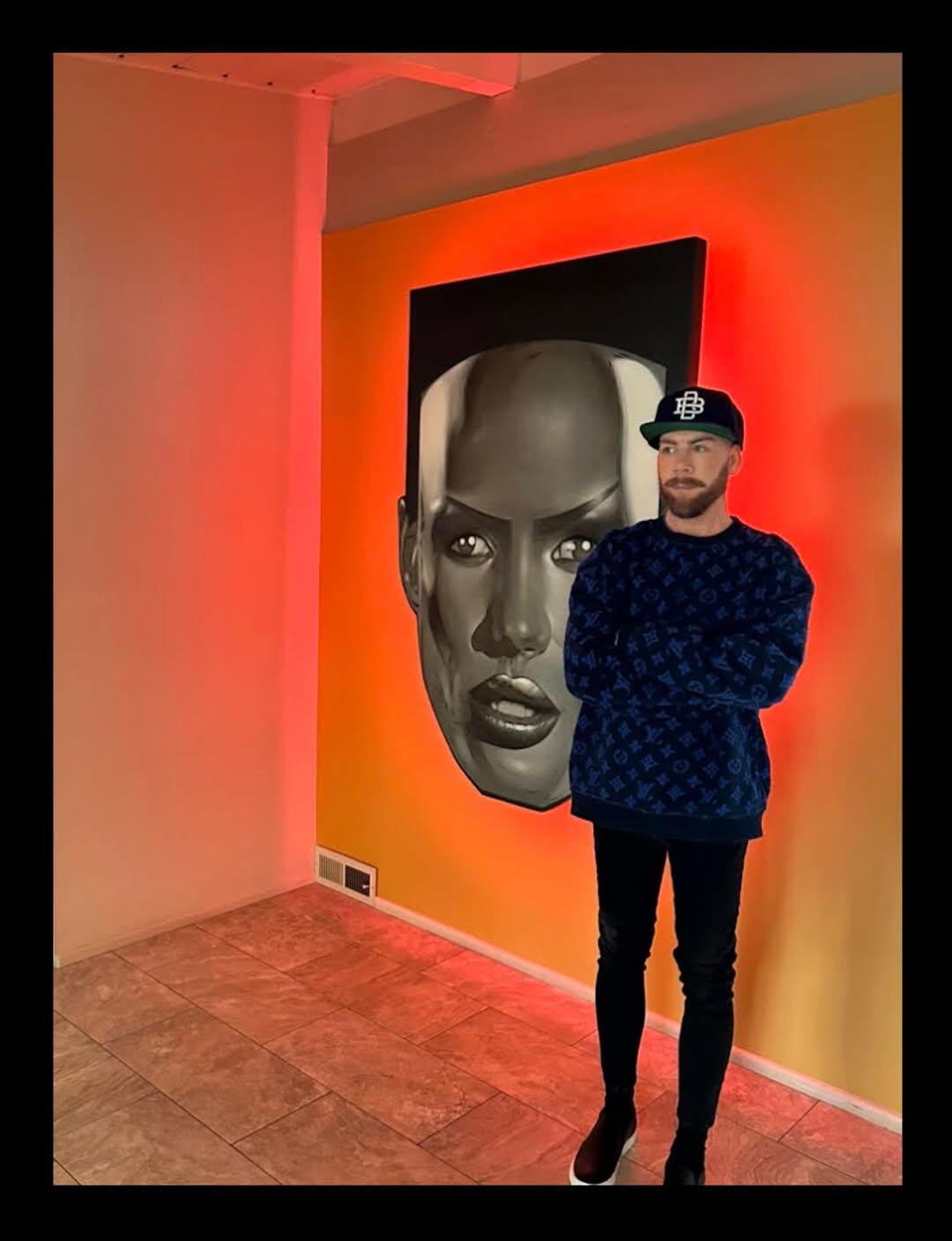 At a collector's home in Long Beach, California. I installed this on a sort of mustard colored wall, which nearly completely neutralizes the pink neon halo.